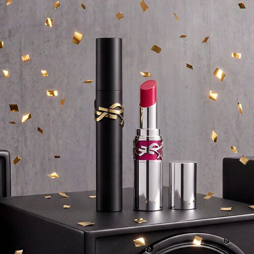 Pre-Black Friday teaser featuring YSL Mascara Lash Clash Volume Extreme and Loveshine Candy Glaze on a black display with gold confetti.