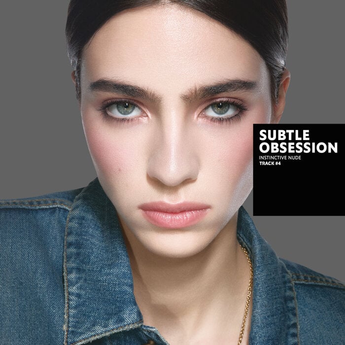 Karen, tanned skin tone, with an instinctive nude eye look and blazing desire glossy lips, wearing a white top.
