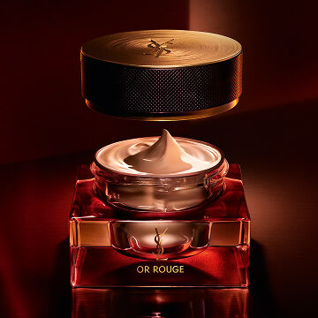 OR ROUGE LE TEINT open jar with floating gold lid. Luxury rejuvenating foundation for a couture 'Inner-Lit' glow.