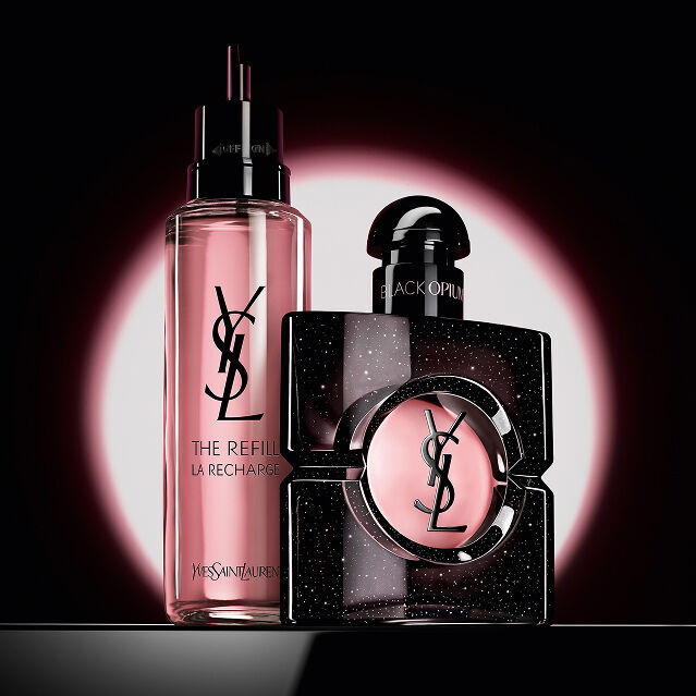 Black Opium Eau de Parfum bottle shown next to its 100ml glass refill bottle with the YSL logo.