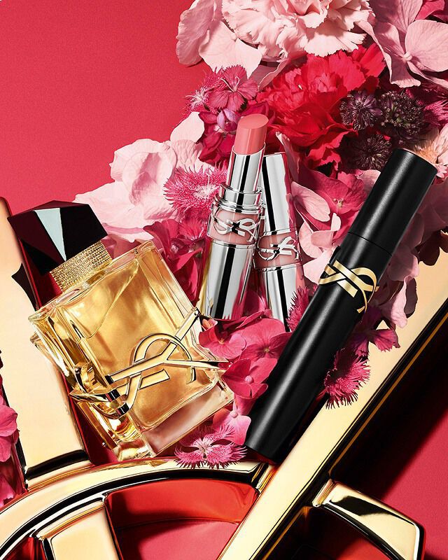 YSL Mother's Day: Libre EDP & Libre EDP Berry Crush, nestled in lush pink florals on a striking red background.