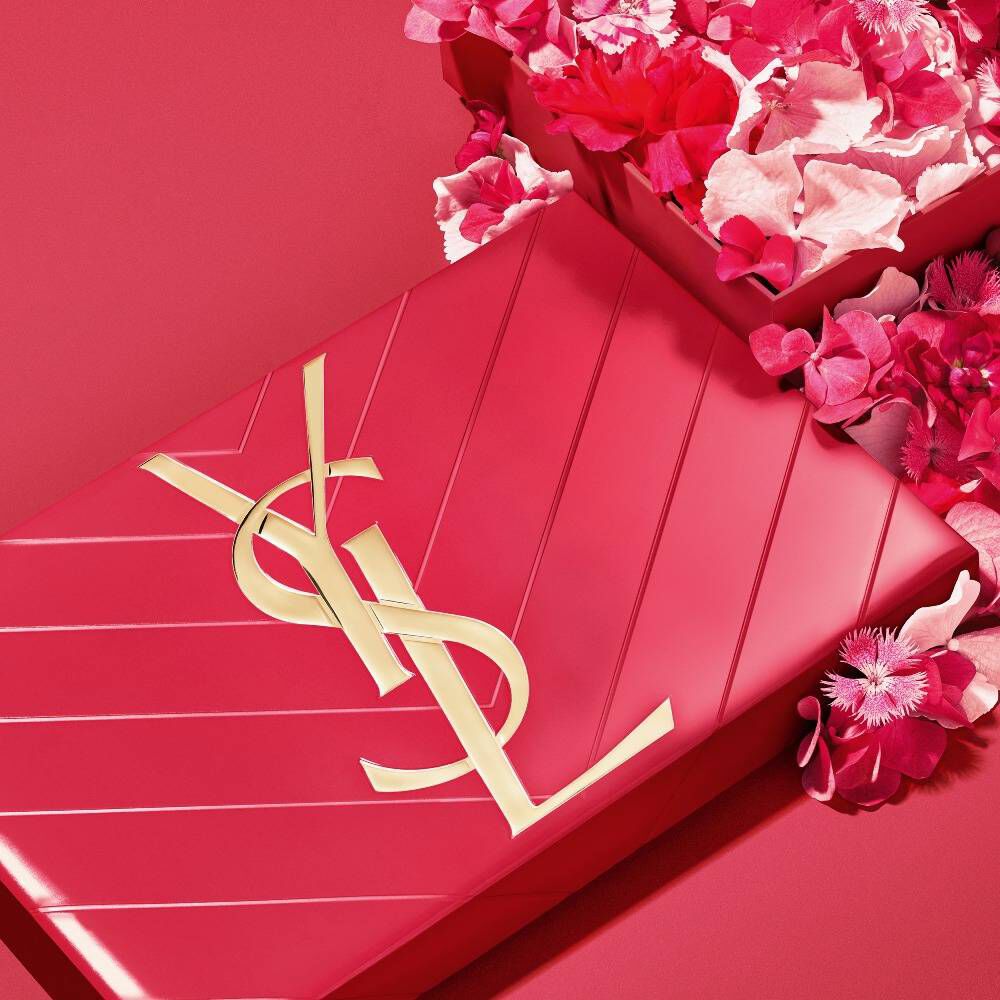 YSL Mother's day pink gift set, featuring the iconic Cassandre logo, overflowing with delicate pink floral accents.