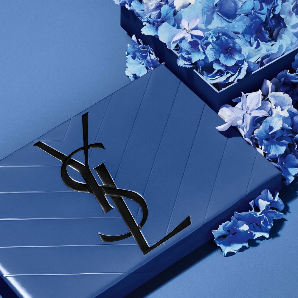 YSL Father's Day blue gift set, featuring the iconic Cassandre logo, overflowing with delicate blue floral accents.