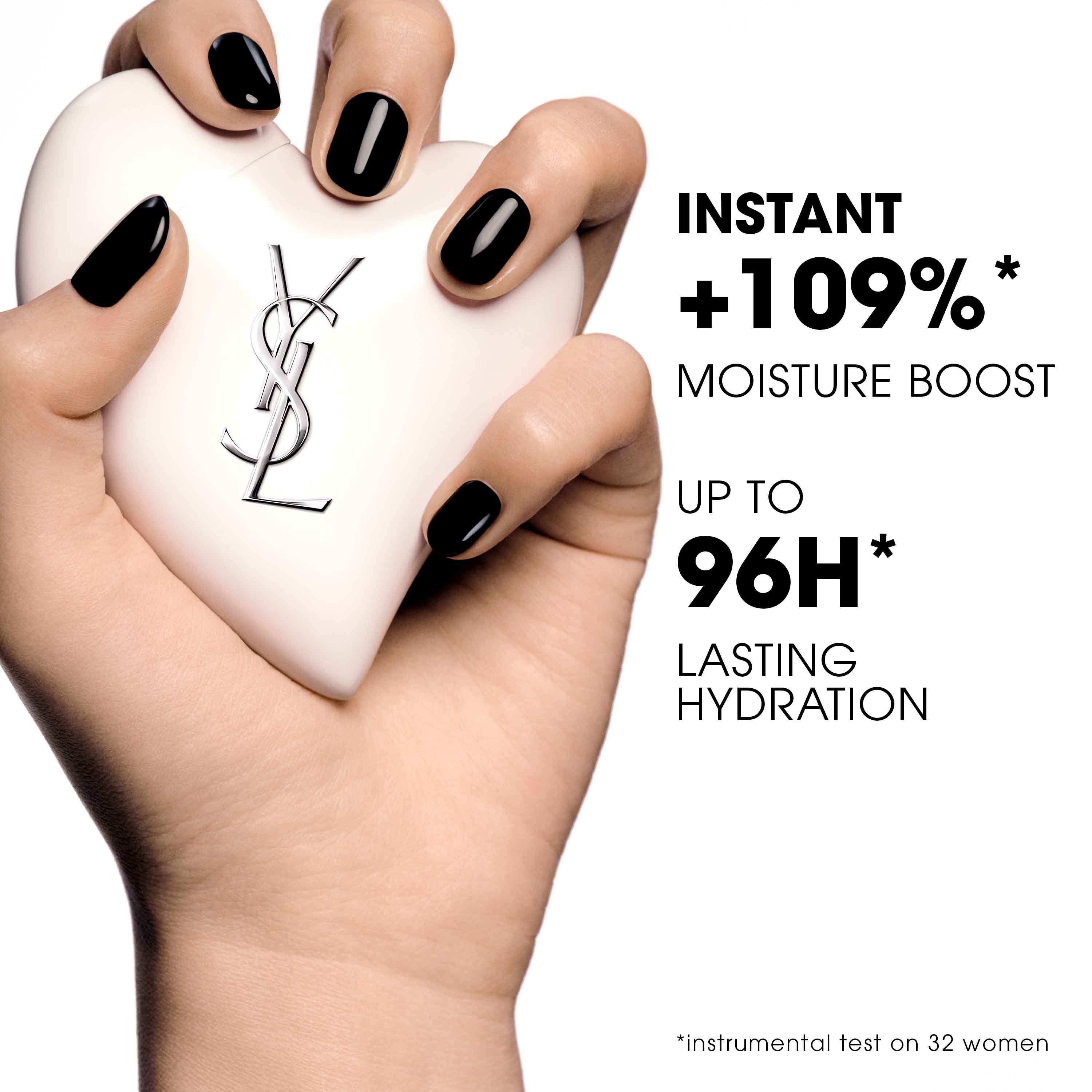 Rose from Blackpink in a black blazer holding Care Crush, a white heart-shaped YSL skincare product.