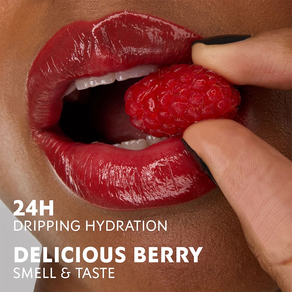 Model Zahara with YSL Loveshine Lipstick in Berry Crush, holding a raspberry, highlighting hydration and berry scent.