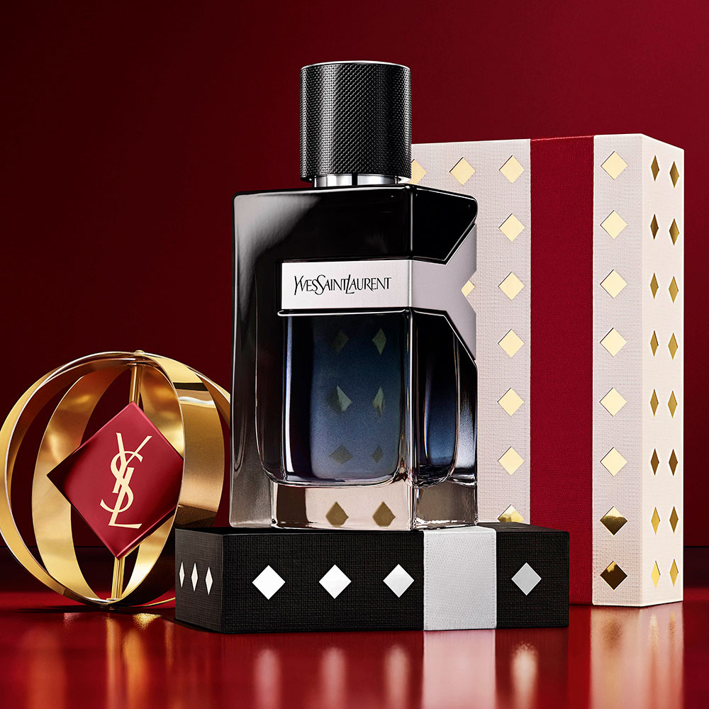 YSL MYSLF Eau de Parfum bottles stacked on black and silver patterned Holiday gift boxes.