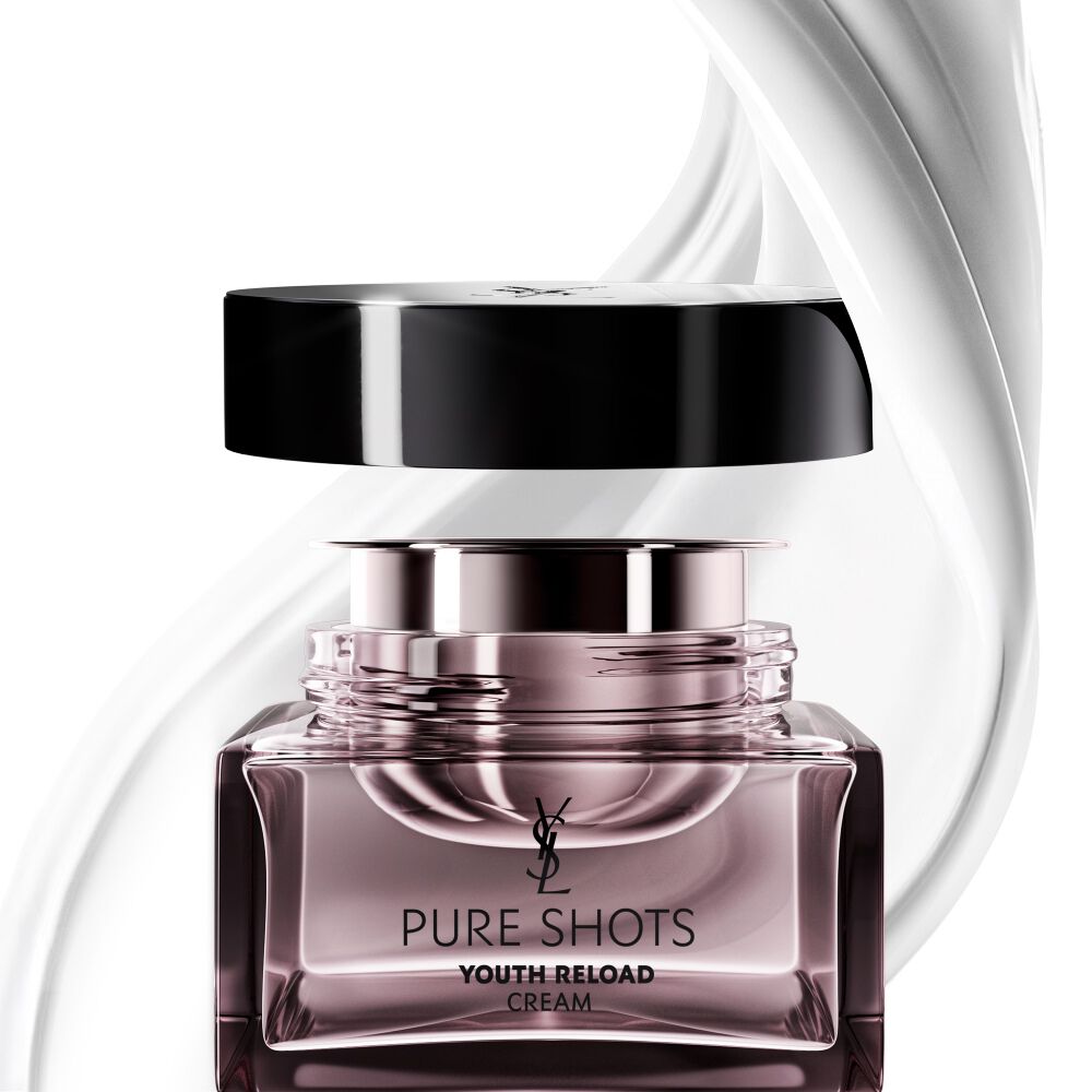 YSL Beauty Pure Shots Youth Reload cream and its sustainable refill, surrounded by a dynamic swirl of its luxurious texture.