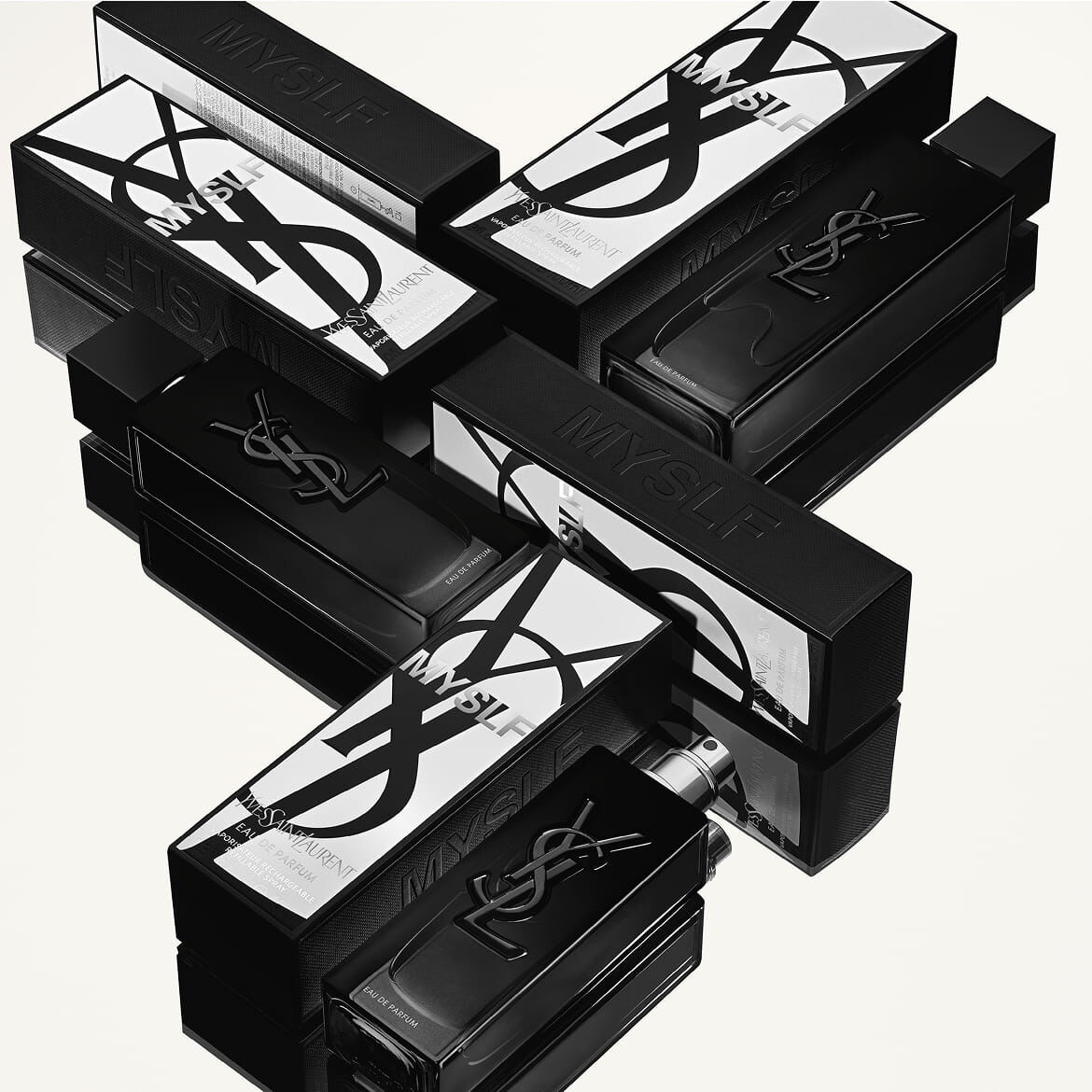 MYSLF Eau de Parfum bottles stacked artistically to form a black Y structure.